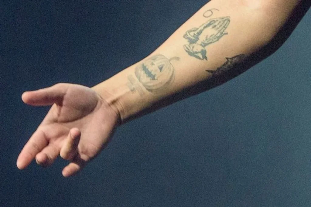 Celebrity Tattoos and What They Mean 14 Drake Tattoo 1