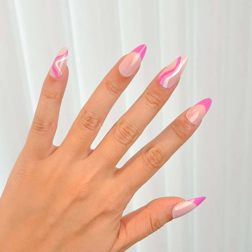 The Ultimate Guide to Nail Shapes – How to Choose the Perfect One 6 a hand wearing 5 pcs of press on nails the set of almond nails is light pink mixed with purple red designed nails french tip