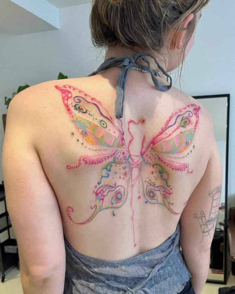 The Ultimate Tattoo Placement Guide: Best Spots for Pain, Longevity & Style 4 butterfly back tattoo women minyeong 1040x1300 1