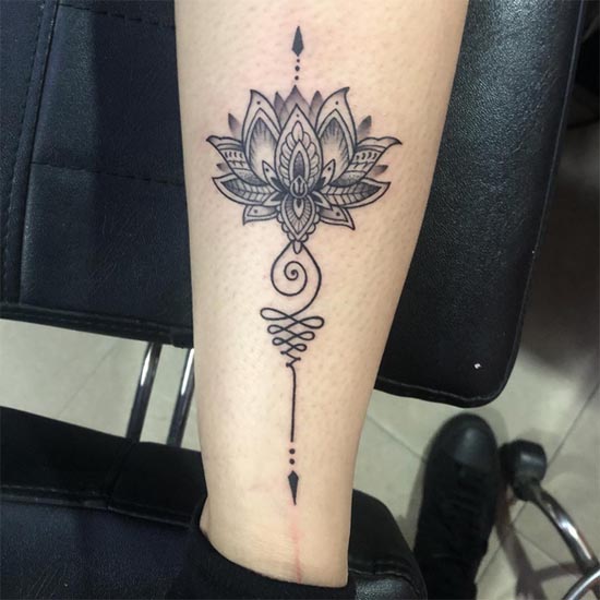The Ultimate Tattoo Placement Guide: Best Spots for Pain, Longevity & Style 7 lotus flower mandala unalome tattoo design lady lower calf