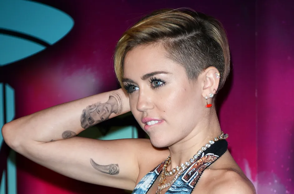 Celebrity Tattoos and What They Mean 8 miley cyrus tattoos billboard 1548