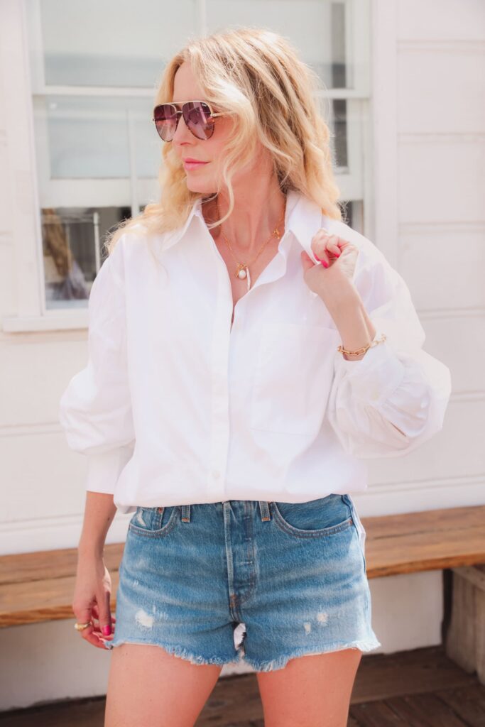 10 Essential Pieces Every Fashionable Woman Should Own in 2025 4 white open edit oversized button down shirt with denim shorts on erin busbee 1